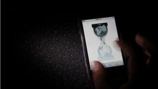 Wikileaks website is pictured on a smartphone