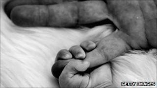 Baby and parent's hand