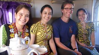 The author with new friends on a train in Turkmenistan