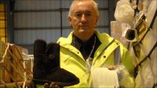 UK Border Agency officer Glen Dickins with fake Ugg boot