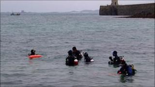 Divers in St Peter Port harbour on Christmas Day 2009