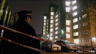 Police officer outside Heron House, on the Pelican Estate, Peckham