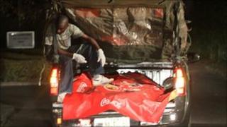 The body of a victim of a bombing in Abuja, Nigeria, is transported to the morgue, 31 December 2010