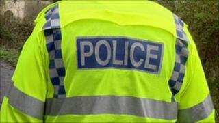 Police officer in high visibility fluorescent jacket