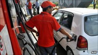A petrol station employee fills up a car in Karachi, Pakistan (file)