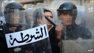 Riot police stand guard in Tunisia