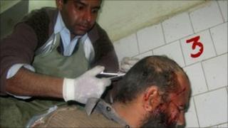 An injured Pakistani paramilitary soldier is treated at a hospital in Bannu on 12 January 2011