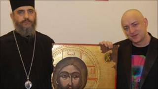 Boy George (r) with Bishop Porfyrios of Neapolis and the Christ icon. Photo by John Kaponi