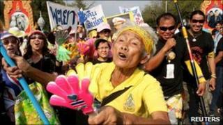 A supporter of the People's Alliance for Democracy (PAD) gestures during a rally outside the Government House in Bangkok