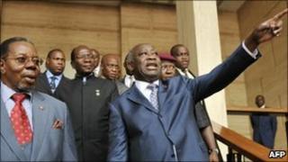 African Union chief and Malawian President Bingu wa Mutharika (L) listens to incumbent Ivorian President Laurent Gbagbo on 25 January 2011 after their meeting at the presidential palace in Abidjan