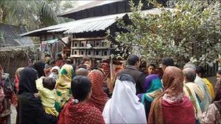 Crowd outside Hena Begum's house
