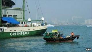 Greenpeace Rainbow Warrior (back L) visits Hong Kong on February 9, 2011