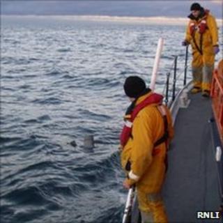 Lifeboat crew recovering wreckage