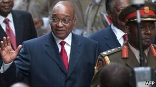 South African President Jacob Zuma waves as he arrives to deliver a state of the nation speech at the parliament in Cape Town on 10 February 2011