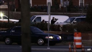 Police take aim during a stand-off at a Cary, North Carolina bank