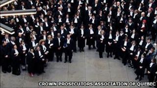 Quebec crown prosecutors hold a silent vigil at the Montreal Palais de Justice
