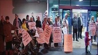Protesters at the meeting