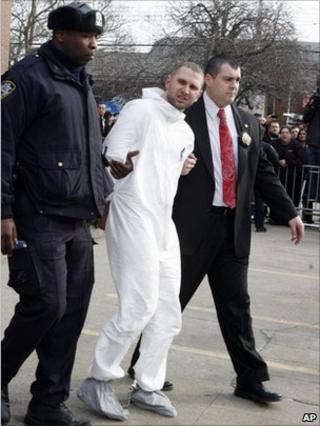 Maksim Gelman, escorted by police in Brooklyn, NY 13 February 2011