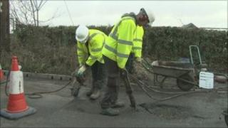 Pothole being repaired