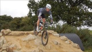 Rider tackling part of the mountain bike course at Hadleigh Farm
