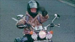 Rider making rude gesture