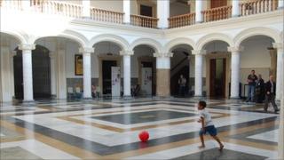 A boy plays football in the courtyard of Venezuela's foreign ministry