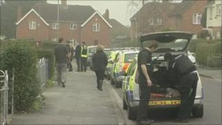 Police and passers-by during operation
