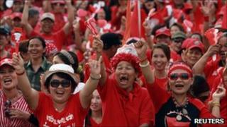 Thai anti-government "red shirt" protesters gestures during a rally at the Democracy monument