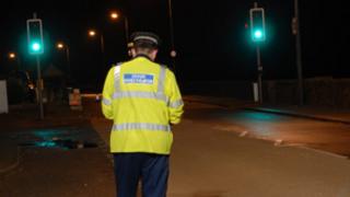 Police officer at crash scene