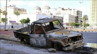 Burnt out car in Benghazi, Libya
