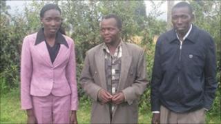 Brother and sister Linet and Moses Masai with Ben Tumwet, the athletics coach from their former school
