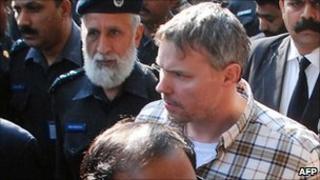Pakistani police escort arrested US national Raymond Davis to a court in Lahore