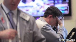 Trader with his head in hands