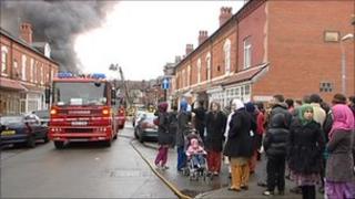 Neighbours look at the fire in Stratford Road