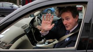 Enda Kenny waving from car window
