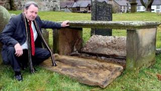 Church warden George Flanagan in the churchyard