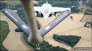 A US Boeing C-135 refuelling a French jet aircraft