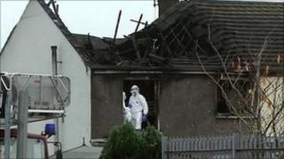 The charred shell of Lammy Crescent where the family-of-seven died
