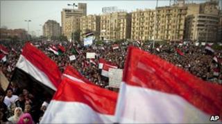 Egyptian protesters gather to demand Libyan leader Muammar Gaddafi step down during demonstrations in Tahrir Square in Cairo