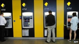 File image of customers using Commonwealth Bank ATMs in Sydney on 18 February 2011
