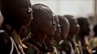 Southern Sudanese soldiers await the arrival of Malawi's President at the airport in the southern Sudanese capital of Juba on 26 January 2011