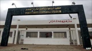 View of the main gate of the stadium named after Hugo Chavez outside Benghazi, with graffiti in Arabic reading Martyrs of February