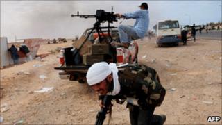 Libyan rebels battled Gaddafi forces in the Libyan port town of Ras Lanuf on Wednesday