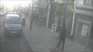 Dr Imran Farooq walking along Station Road