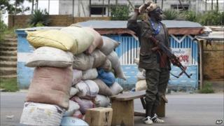 Pro-Ouattara fighter at roadblock