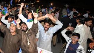 Jamaat-i-Islami supporters shout slogans as they march toward the US embassy