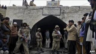 Pakistani soldiers outside the coal mine in Sorange district after the explosions on 20 March 2011