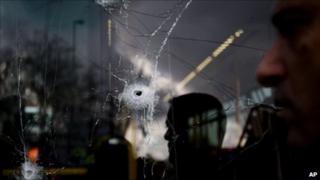 Holes on a bus window after an explosion in Jerusalem (23 March 2011)