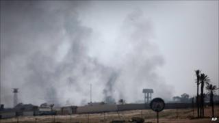Smoke rises from a Libyan military base on the outskirt of Tajoura, east of Tripoli, March 25, 2011