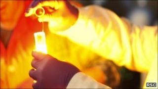 Chemist mixing chemicals in test tubes (Royal Society Chemistry)